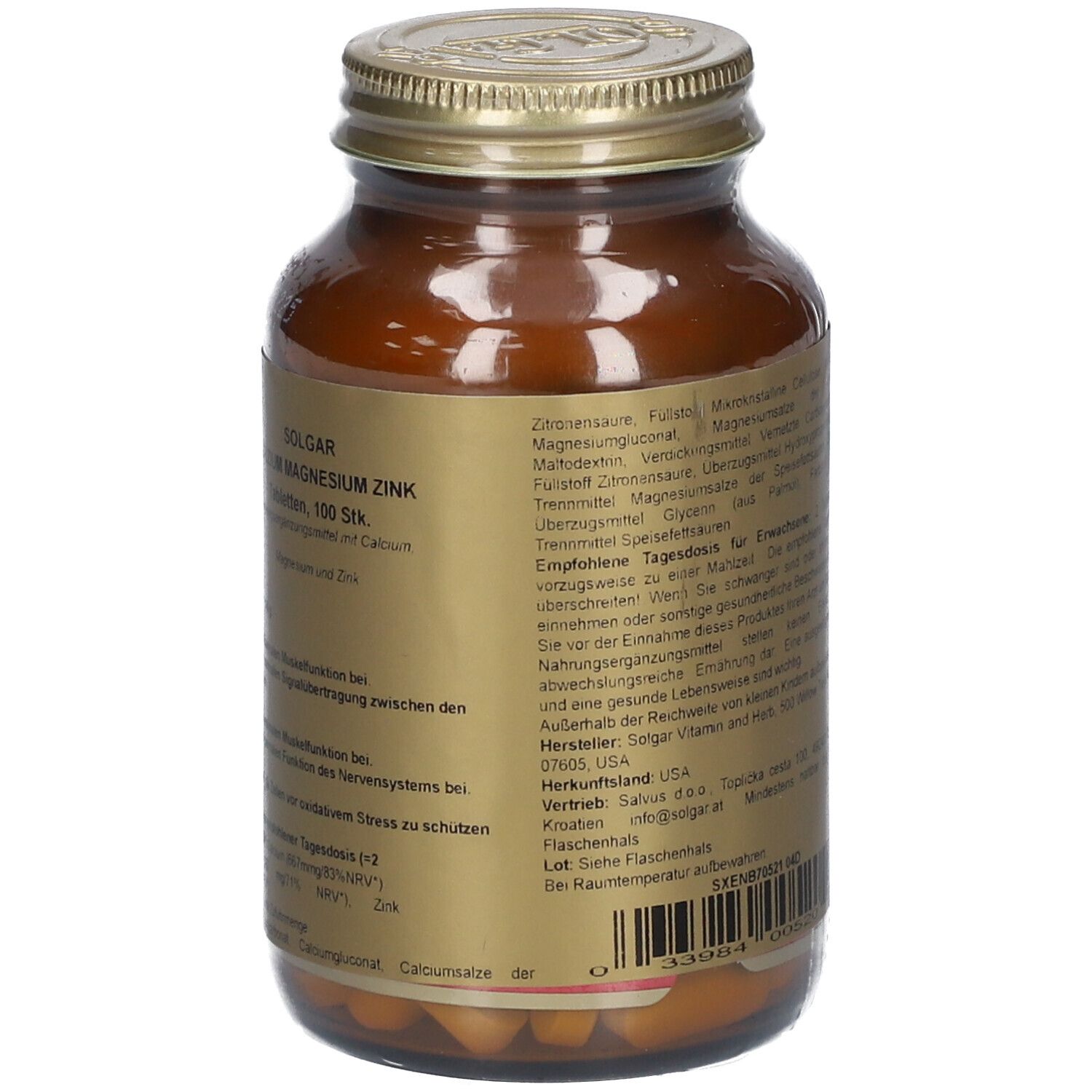 Retro di un flacone di vetro marrone con coperchio dorato. Testo in tedesco. Contiene ingredienti e istruzioni per l'uso.