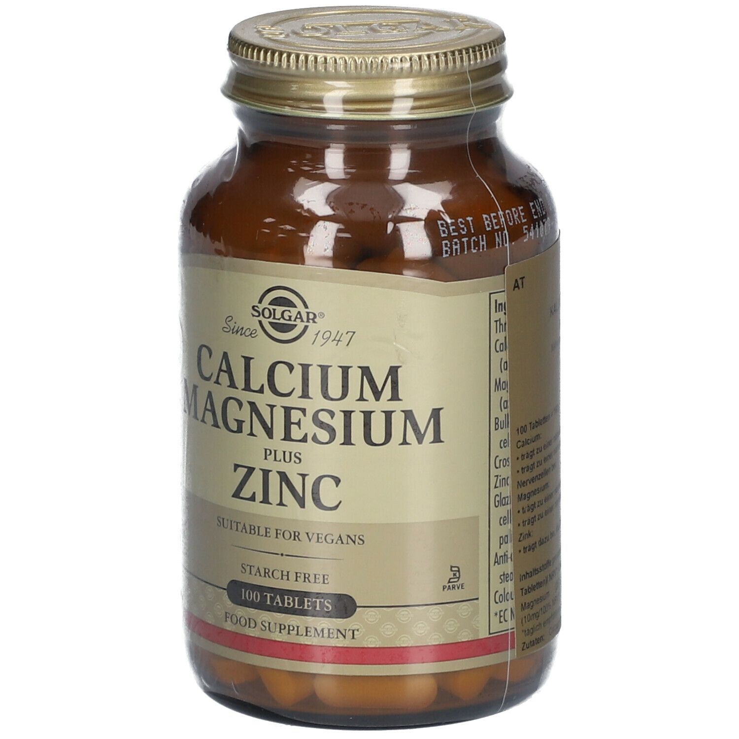 Flacone di vetro marrone con coperchio dorato. Scritta: Calcium Magnesium Plus Zinc. Adatto ai vegani. 100 compresse.