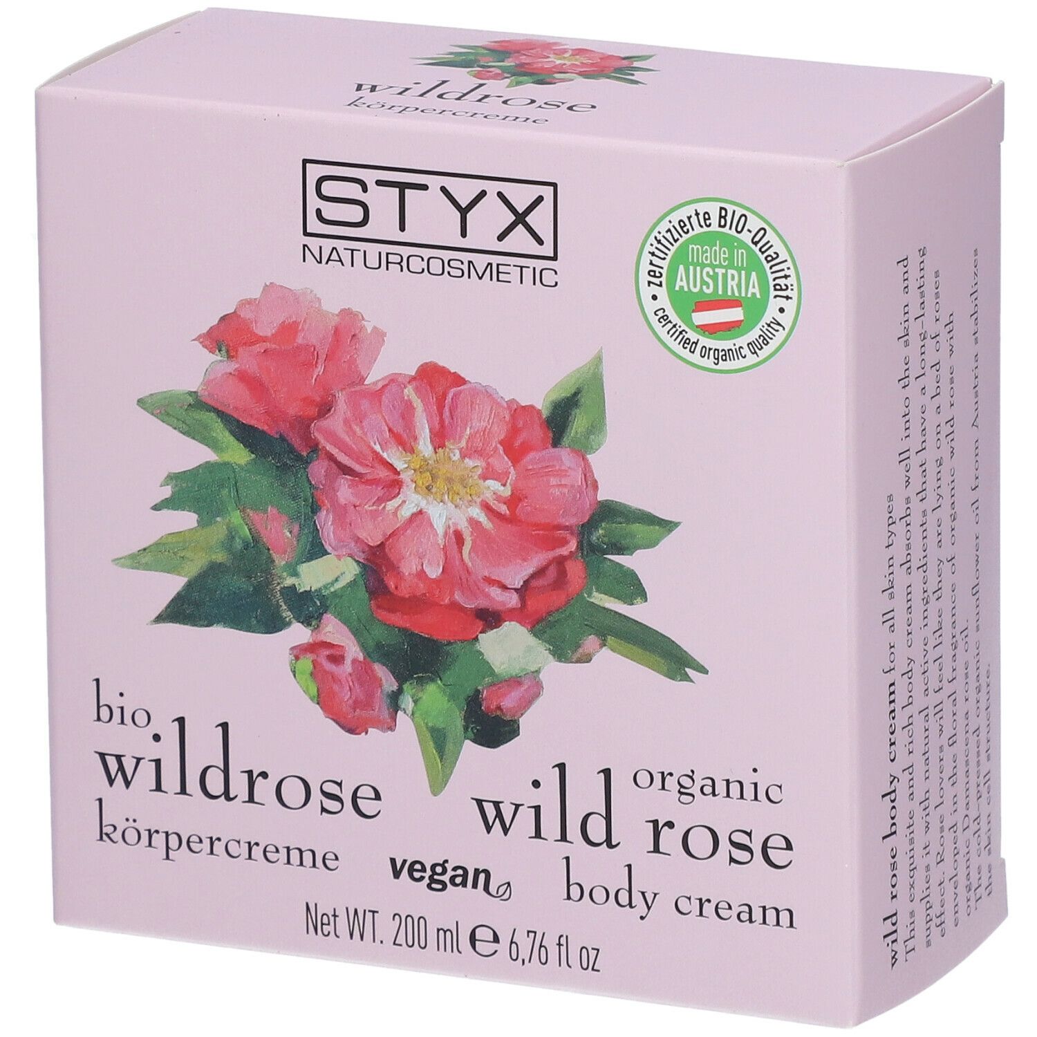Confezione di crema corpo rosa con logo STYX, illustrazione di rosa selvatica e sigillo di qualità bio.