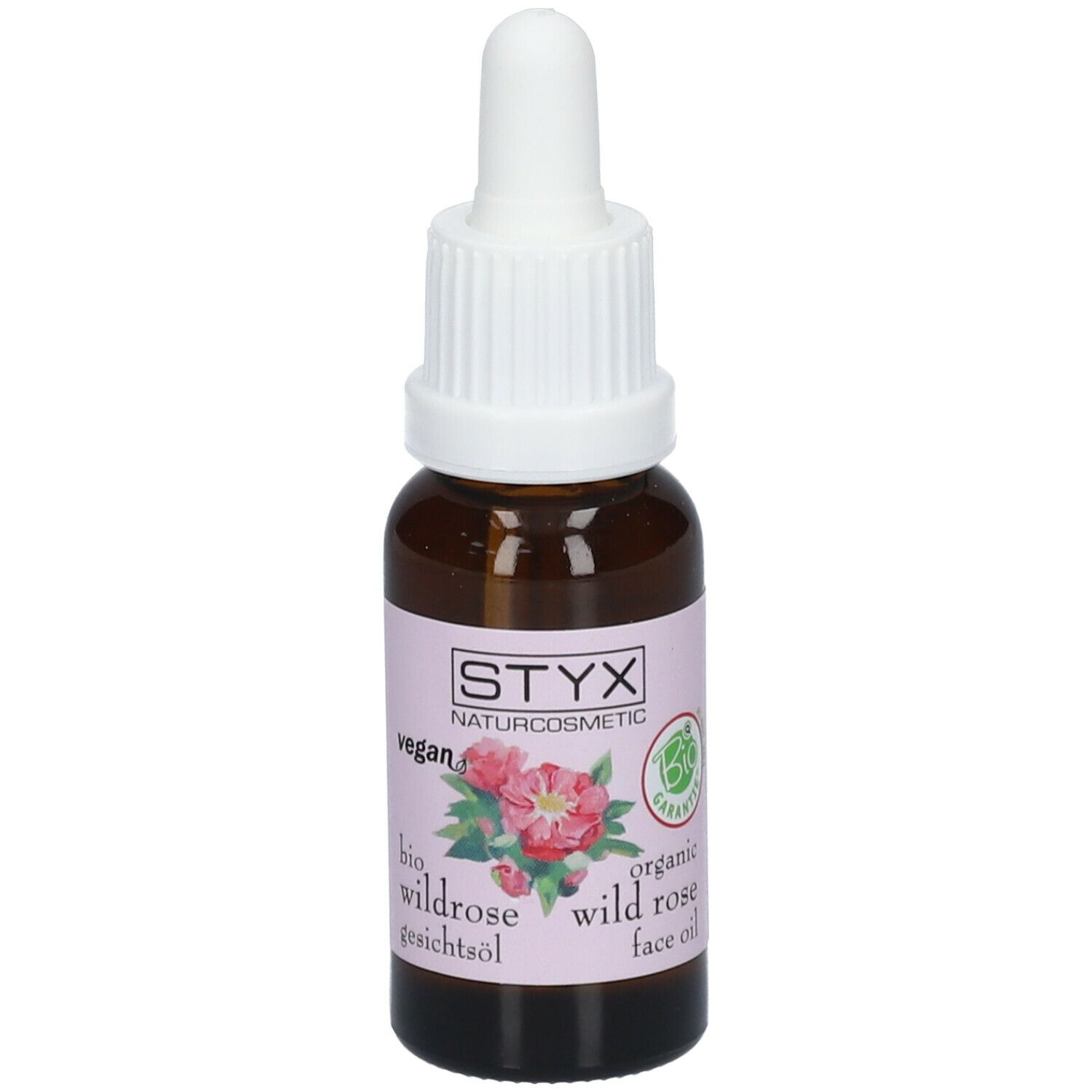 Flacone di vetro marrone con contagocce bianco. Etichetta con logo STYX, illustrazione di rosa selvatica e testo. Sigillo vegano.