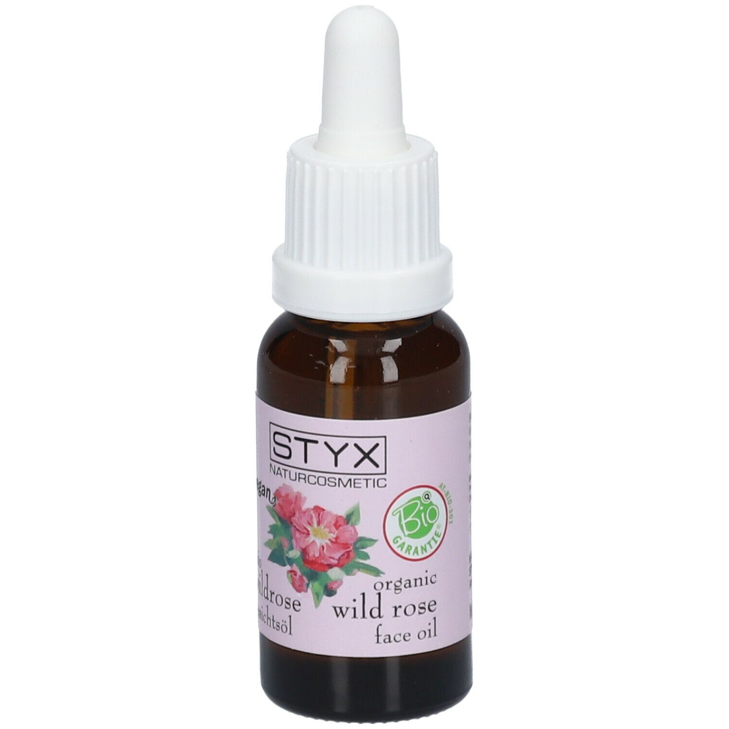 Flacone di vetro marrone con contagocce bianco. Etichetta con logo STYX, illustrazione di rosa selvatica e testo. Sigillo bio.