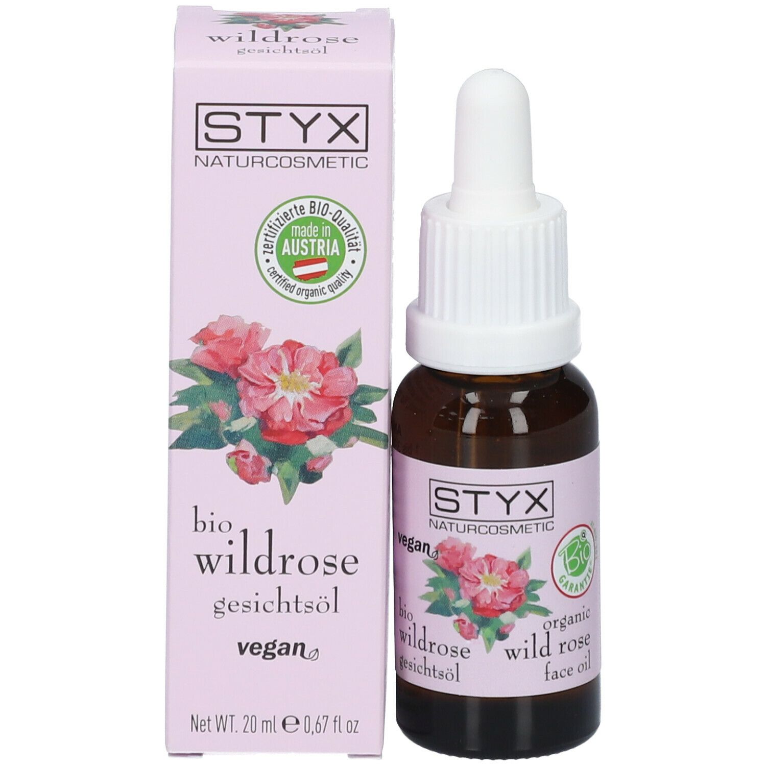 Scatola rosa con logo STYX, illustrazione di rosa selvatica e testo. Contiene un flacone di vetro marrone con contagocce.