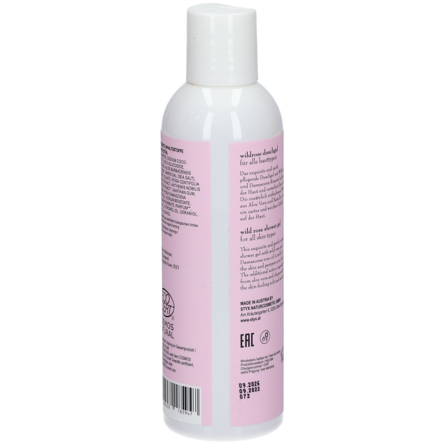 Gel doccia STYX Wildrose. Retro della bottiglia. Testo in tedesco e inglese. Bottiglia bianca con etichetta rosa.