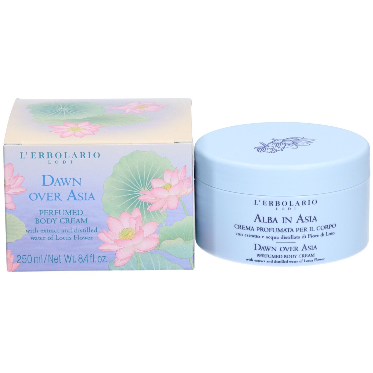 Vaso di crema e confezione. Scritta: L'ERBOLARIO, DAWN OVER ASIA, PERFUMED BODY CREAM. Sono raffigurate fiori di loto.