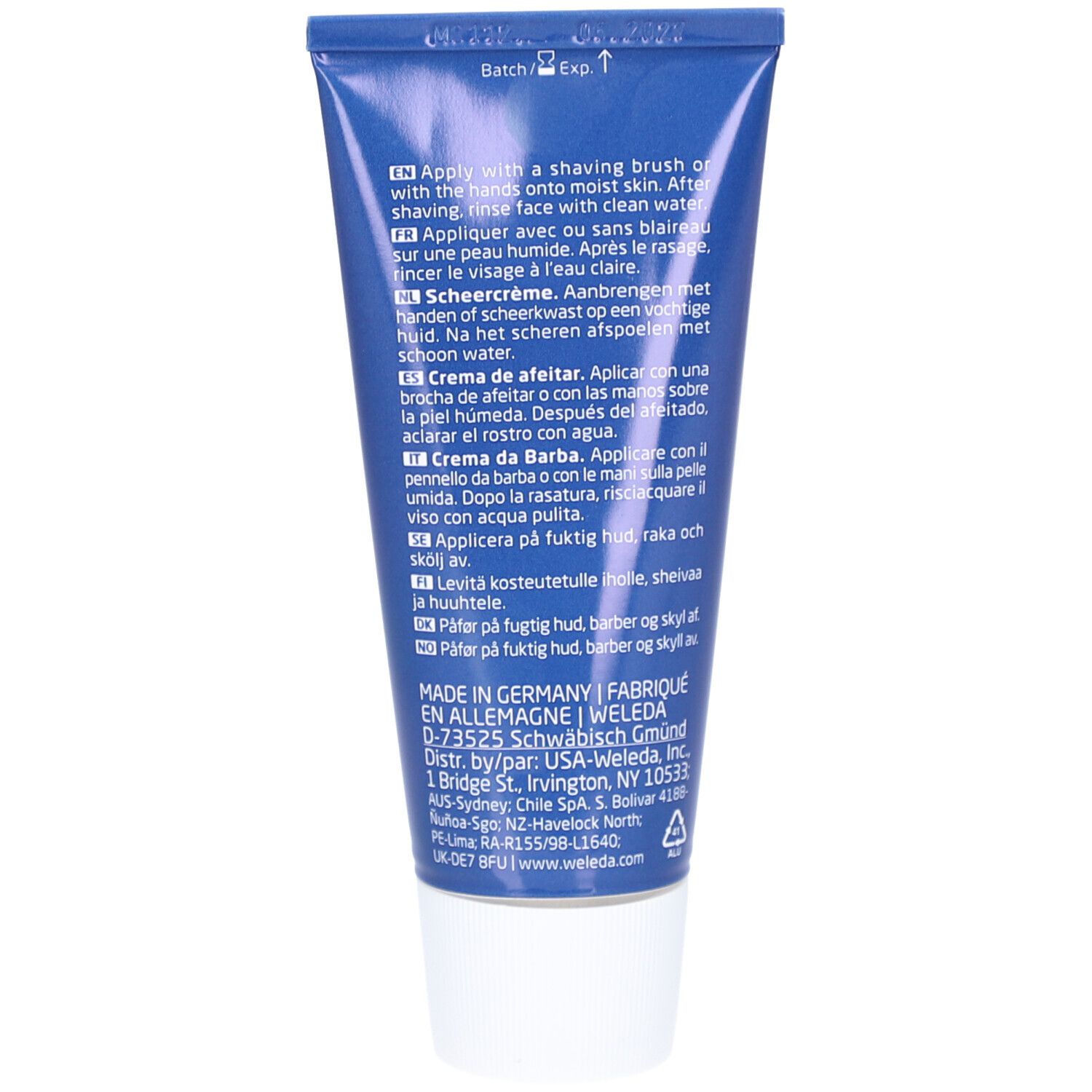 Tubo blu con tappo a vite bianco, contiene crema da barba. Testo in italiano, inglese, tedesco, francese, spagnolo, olandese e finlandese.