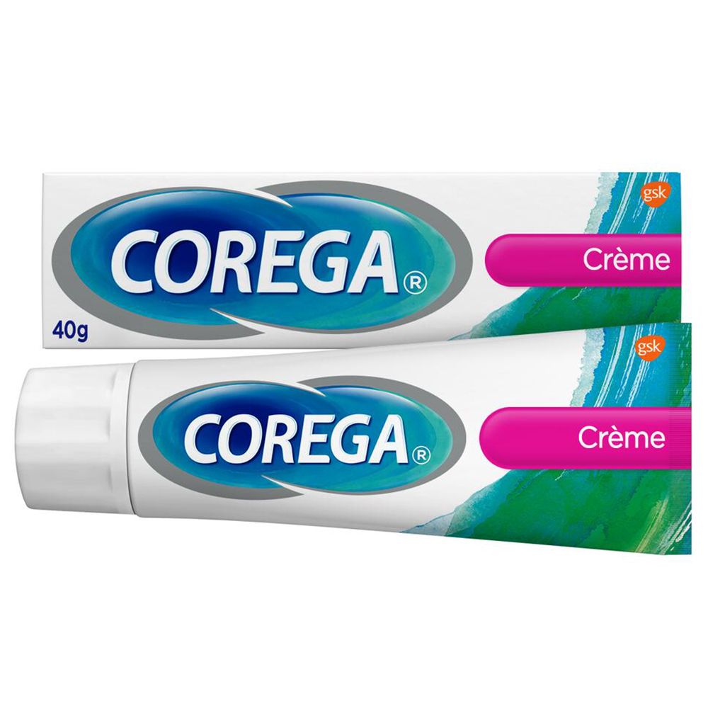Due tubi di Corega Crème. Bianco, blu, rosa. 40g. Marchio e nome del prodotto visibili.