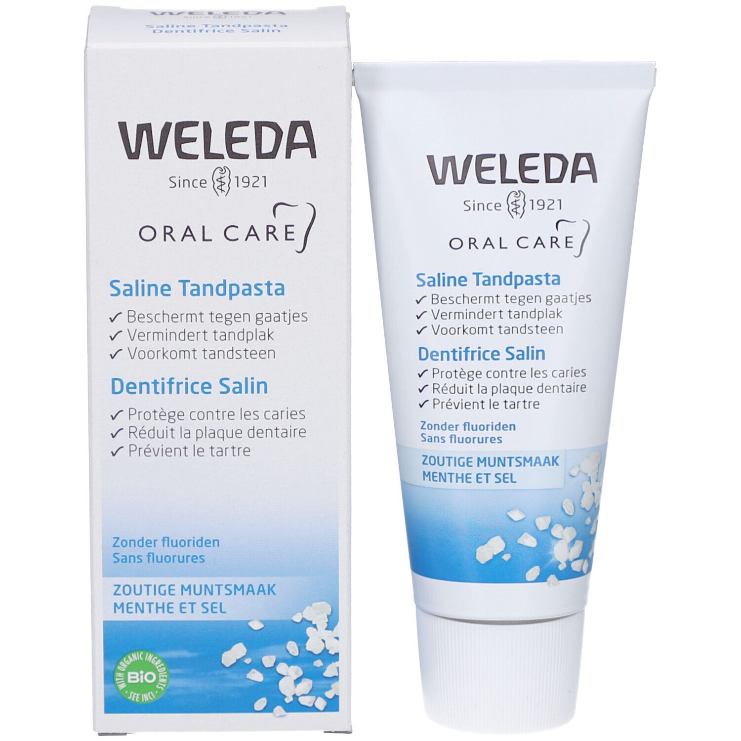 Tubo e scatola di dentifricio Weleda Saline. Bianco, con testo e illustrazioni blu. Contiene testo in tedesco, francese e olandese.