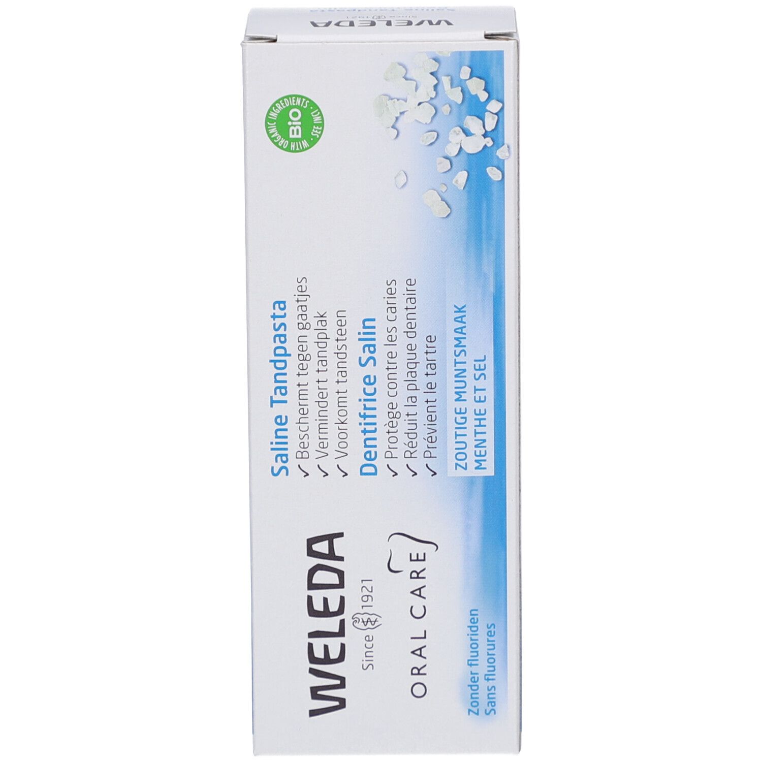 Lato della scatola di dentifricio Weleda Saline. Contiene testo in tedesco, francese e olandese. Certificazione biologica.