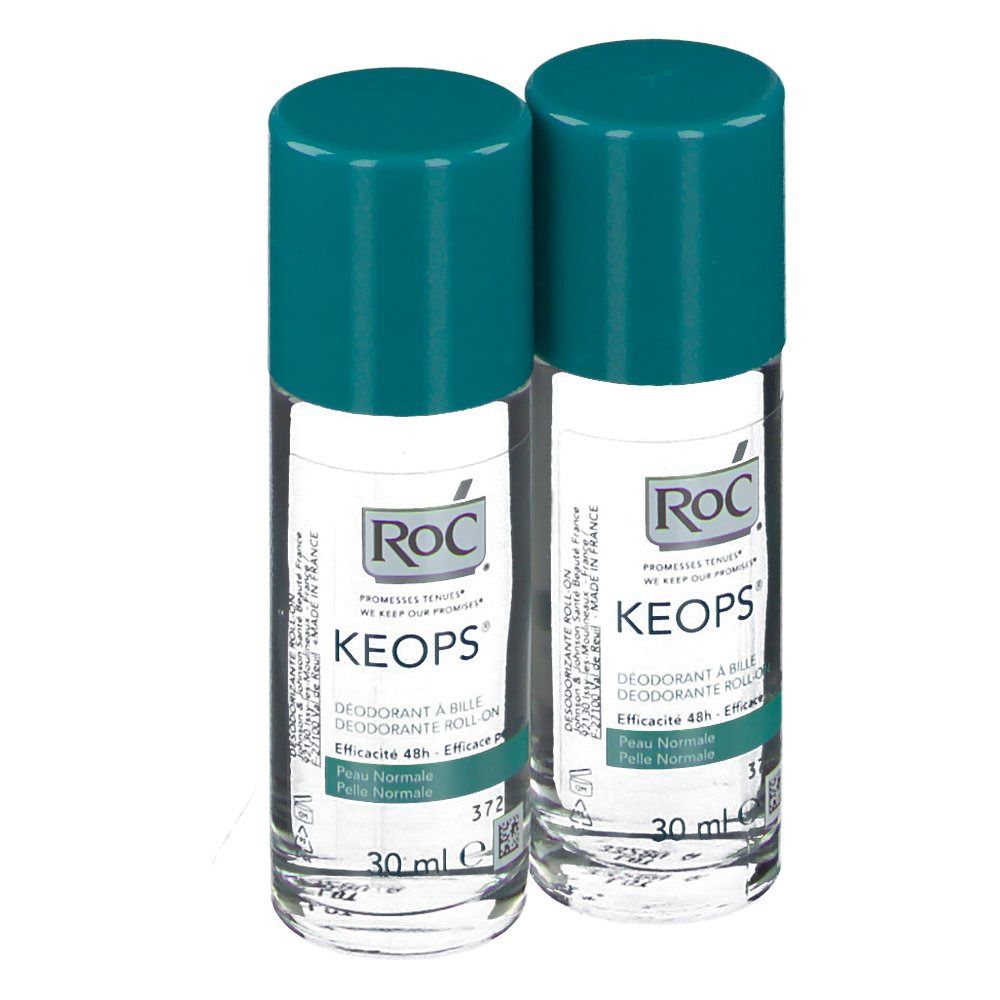 Due deodoranti roll-on con tappi turchesi. Scritta RoC Keops. Etichette con informazioni sul prodotto.