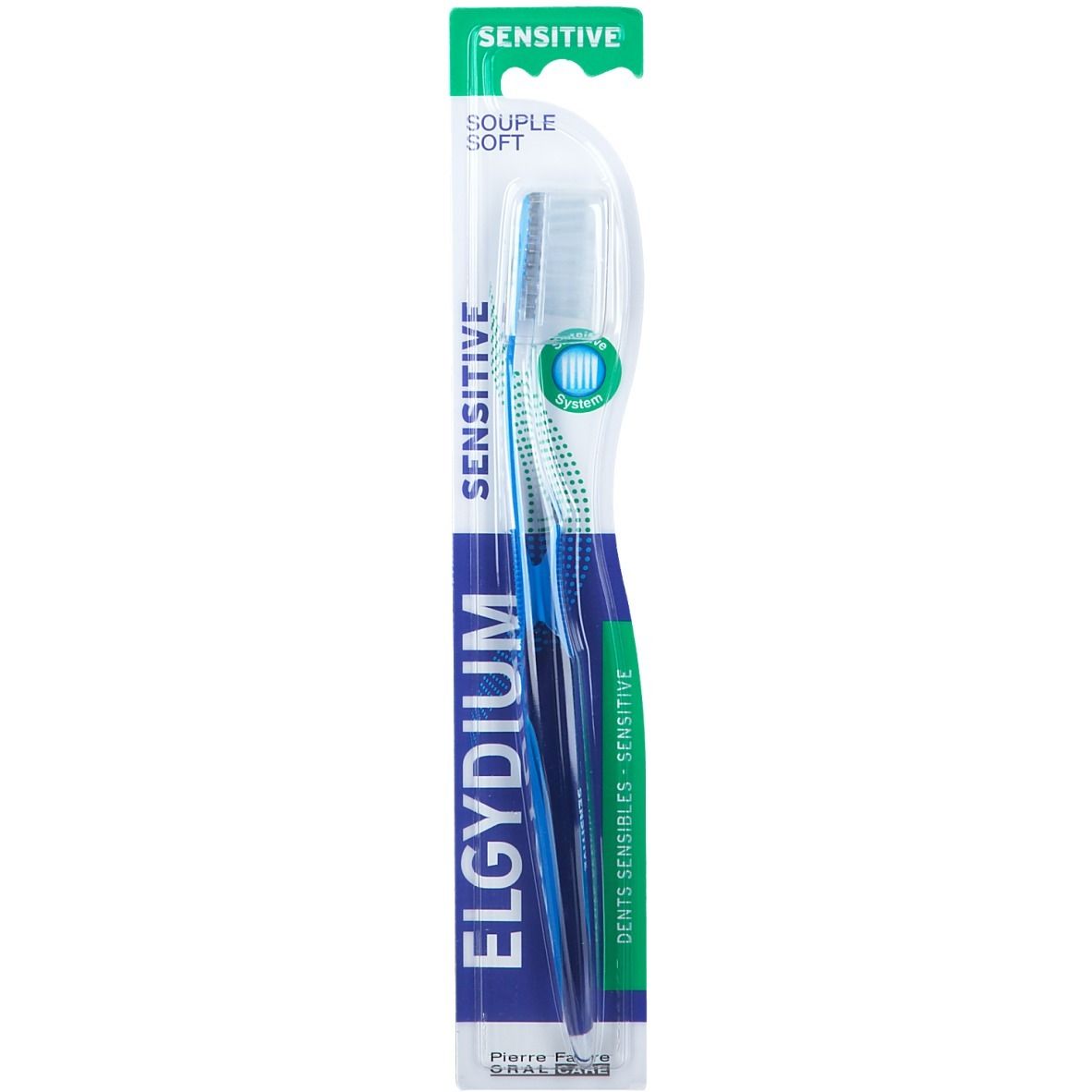 Spazzolino blu con testina bianca in confezione. Scritta: ELGYDIUM SENSITIVE. Pierre Fabre ORAL CARE.