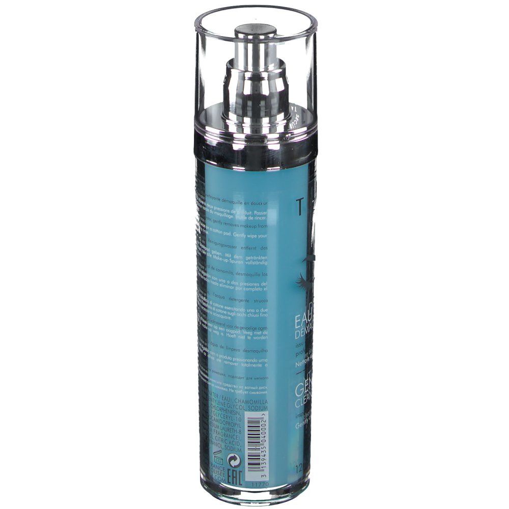 Flacone cilindrico con erogatore a spruzzo. Liquido blu turchese. Scritte e testo sul flacone. Tappo argentato.