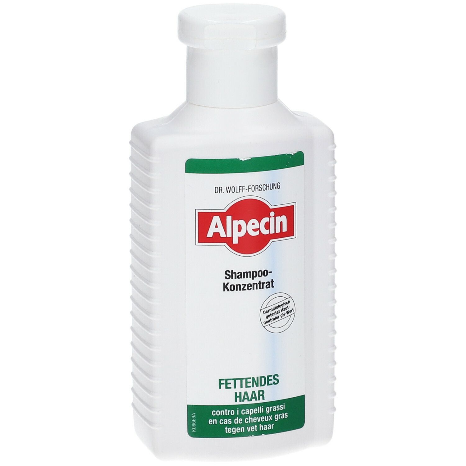 Flacone bianco con etichetta verde e rossa. Scritta: Alpecin Shampoo concentrato per capelli grassi.
