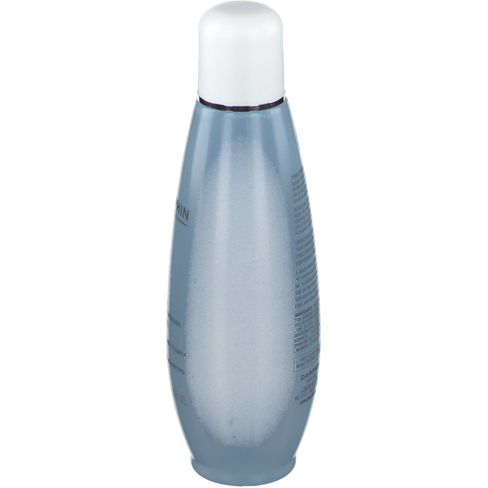 Vista posteriore di un flacone blu trasparente con tappo bianco. Testo sul flacone.