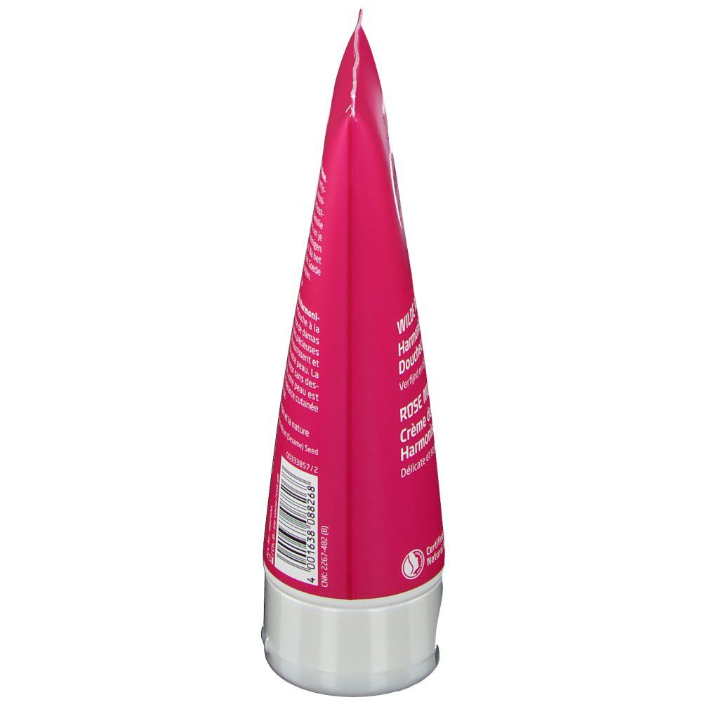 Vista laterale del tubo. Tubo rosa con tappo bianco. Testo e codice a barre visibili. Nome del prodotto e logo parzialmente riconoscibili.