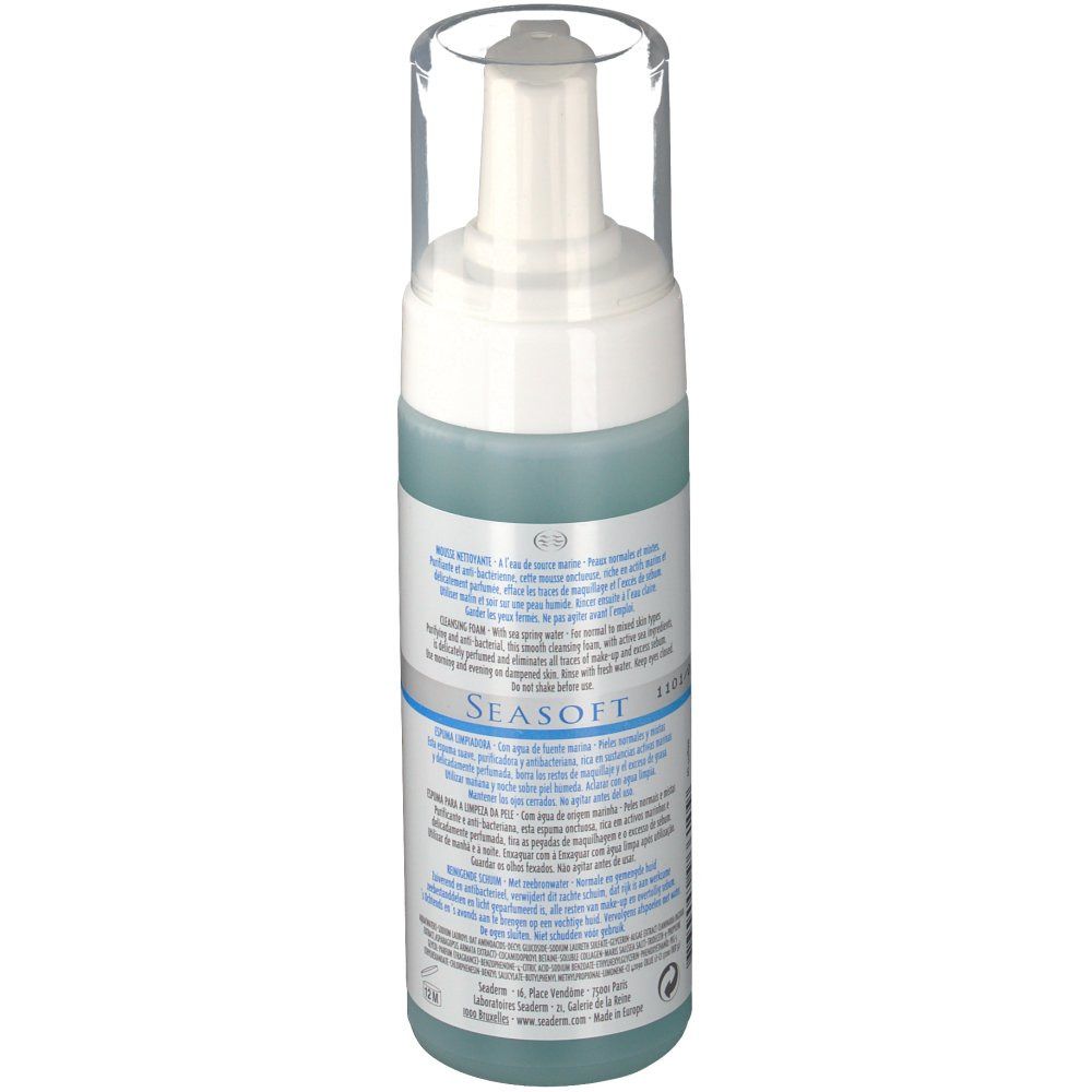 Flacone di mousse detergente con erogatore bianco e tappo trasparente. Liquido blu visibile. Testo sull'etichetta.