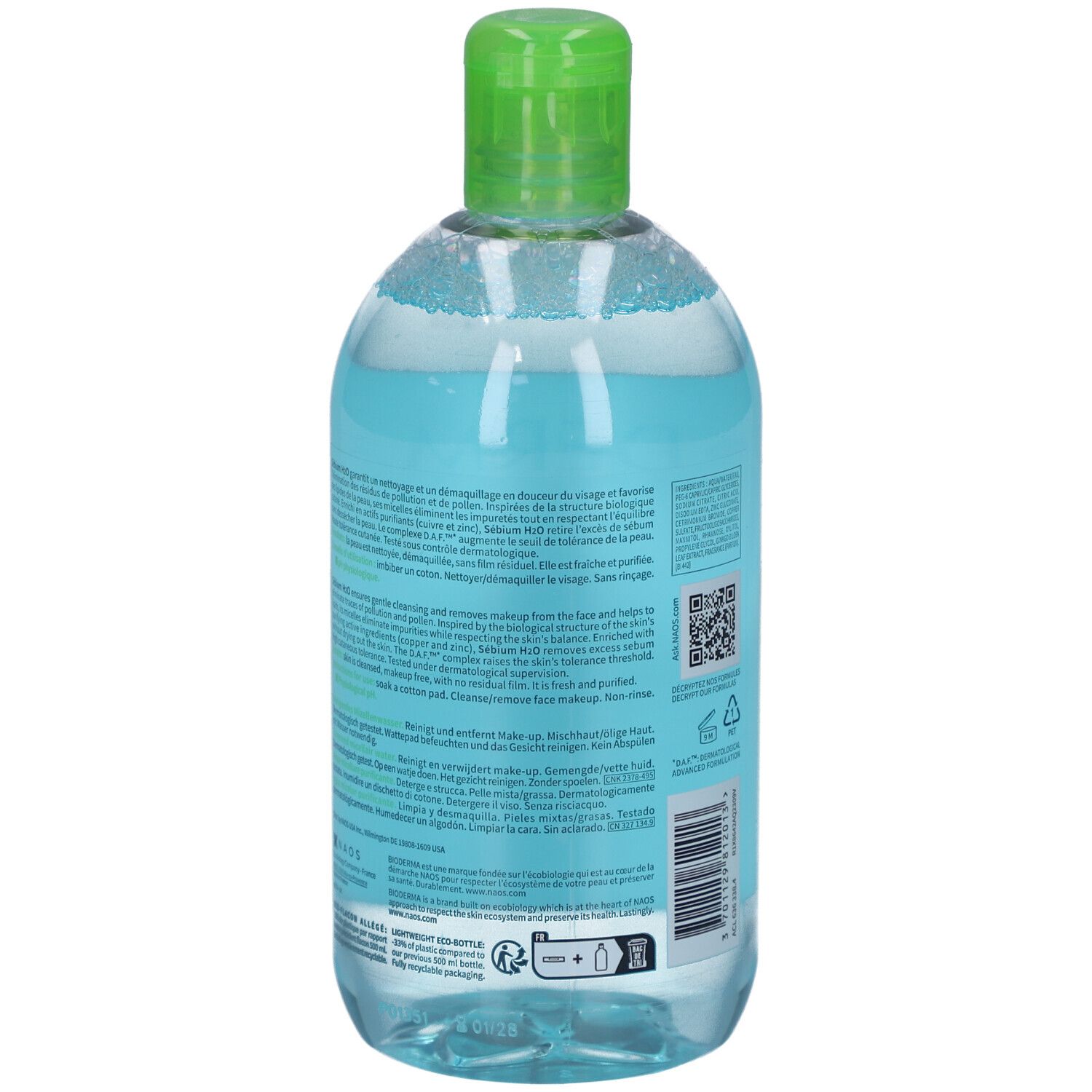 Bottiglia trasparente con tappo verde, riempita di liquido trasparente. Etichetta con testo. Vista posteriore.