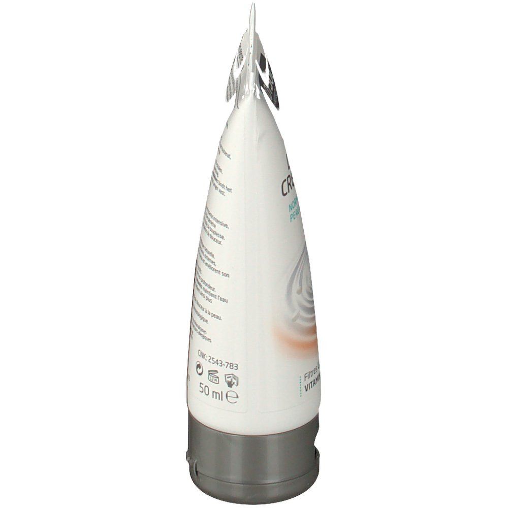 Vista laterale del tubo di crema. Testo sul tubo. Contiene informazioni sugli ingredienti e l'uso.