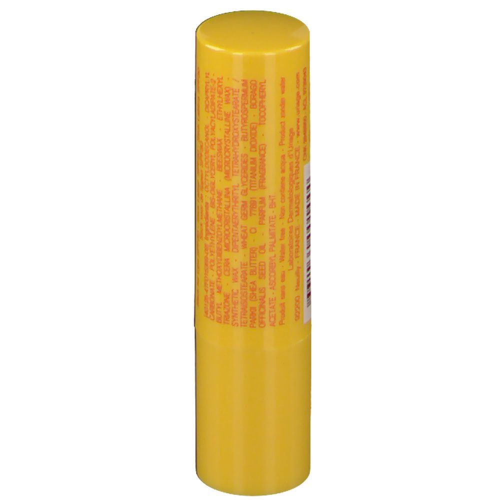 Stick labbra giallo con testo. Contiene ingredienti e informazioni produttore.
