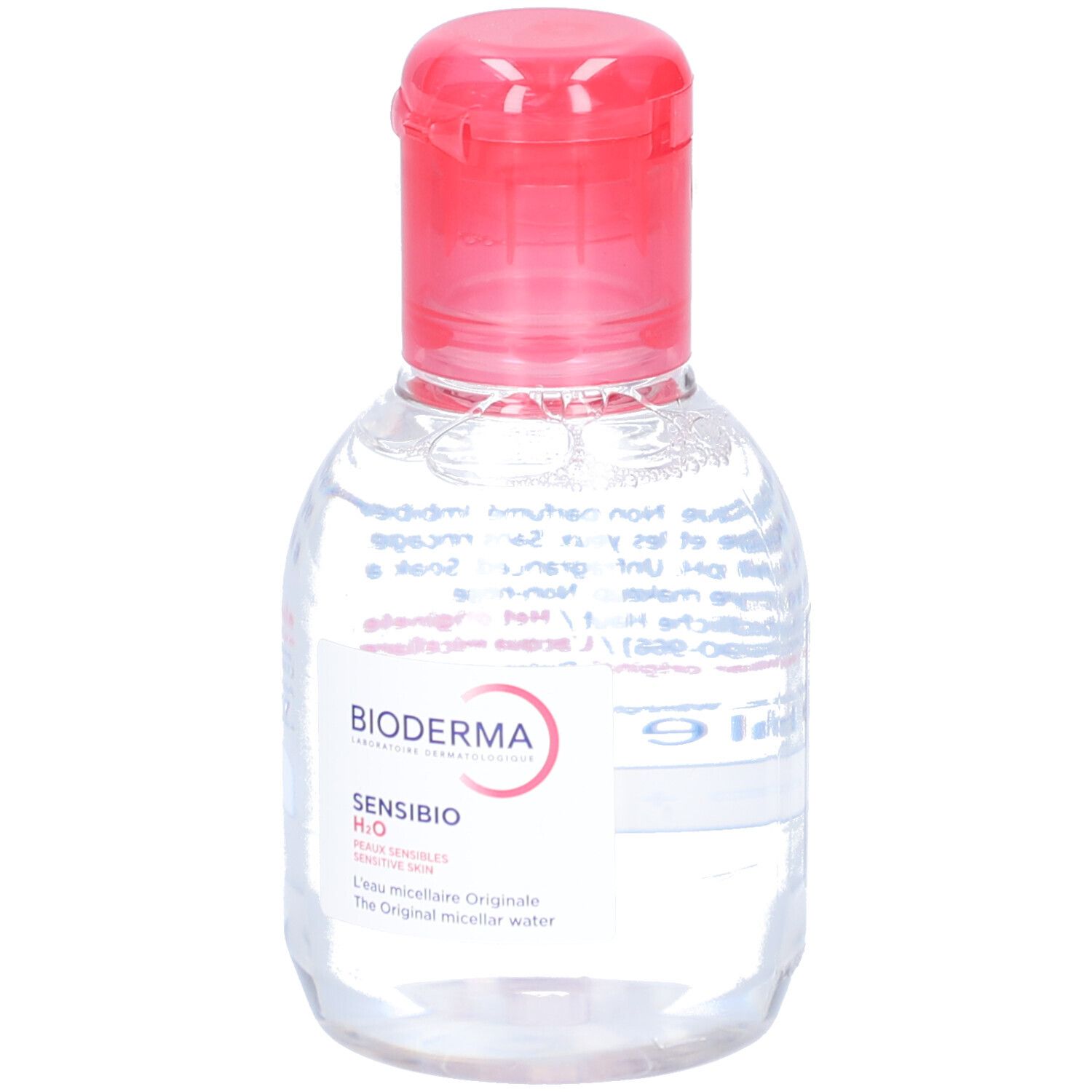 Piccola bottiglia trasparente con tappo rosso. Etichetta con BIODERMA e Sensibio H2O. Prodotto per pelli sensibili.