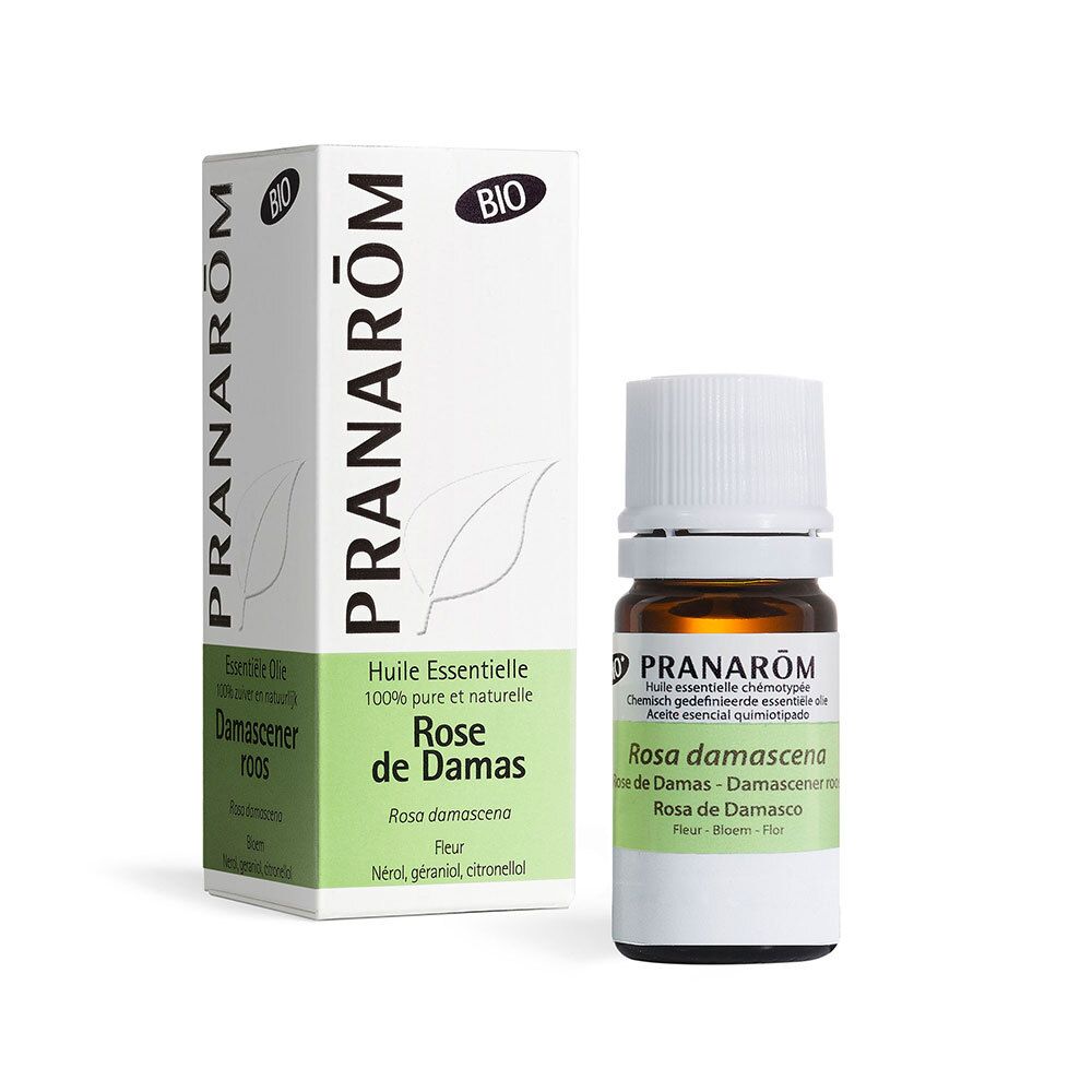 Flacone di vetro marrone con tappo bianco e confezione. Scritta: Pranarom Rose de Damas.