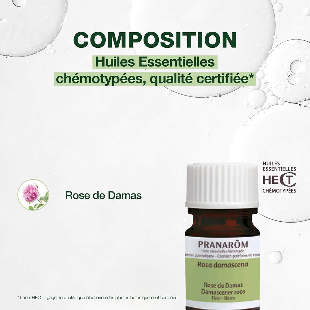 Flacone di vetro marrone con tappo bianco. Scritta: Pranarom Rose de Damas. Sfondo verde.