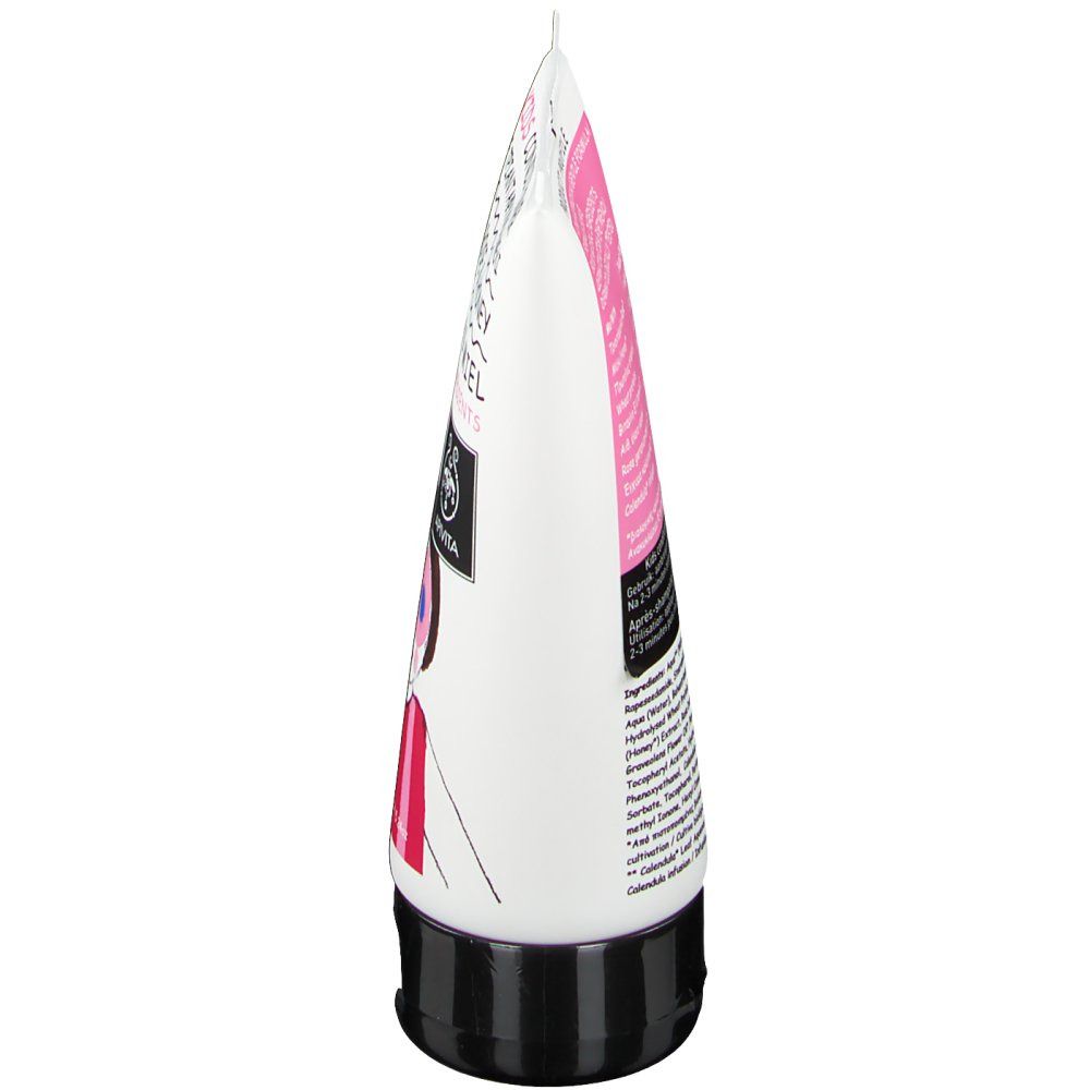 Vista laterale di un tubo bianco con tappo nero. Dettagli rosa e neri. Testo sul tubo.