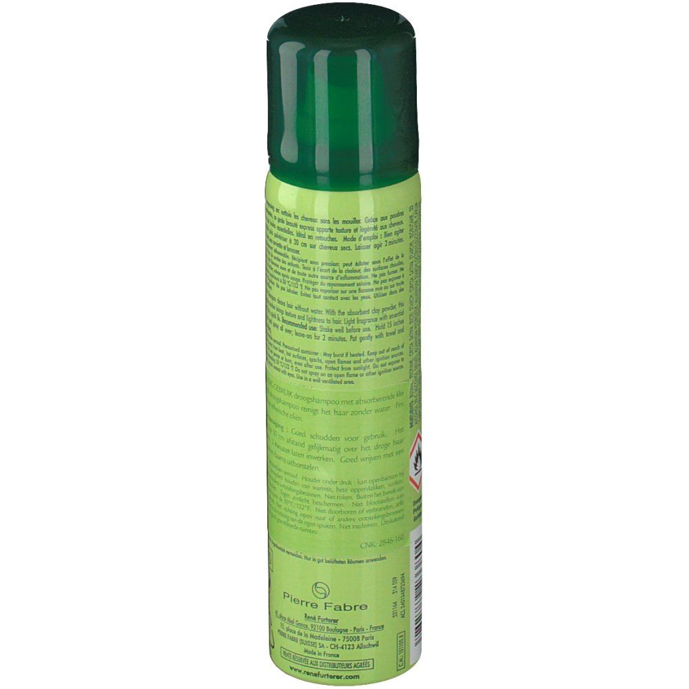 Flacone spray verde con tappo verde. Testo sul flacone.