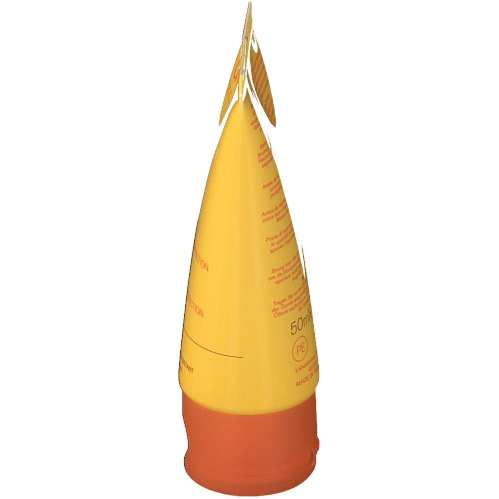 Tubo giallo, tappo arancione. Informazioni sul prodotto sul tubo.