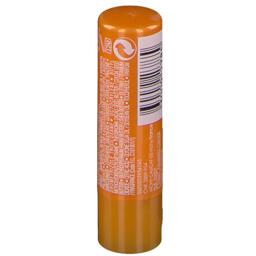 Retro di uno stick labbra arancione. Codice a barre e informazioni testuali.