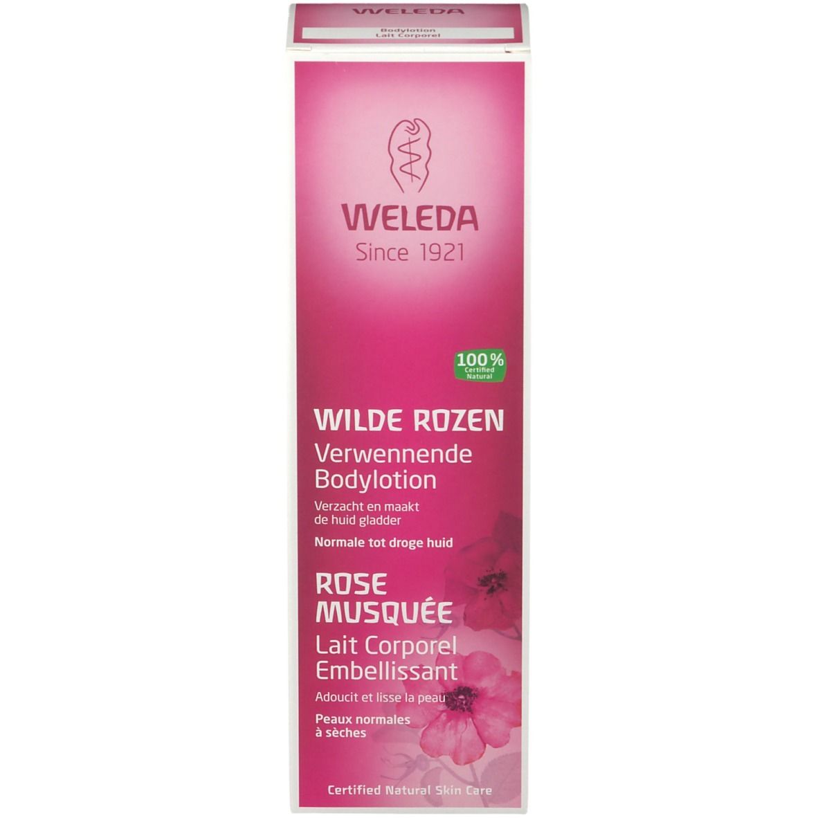 Scatola di lozione per il corpo Weleda. Scatola rosa con testo: Wilde Rozen, Rose Musquée. 100% Natural.