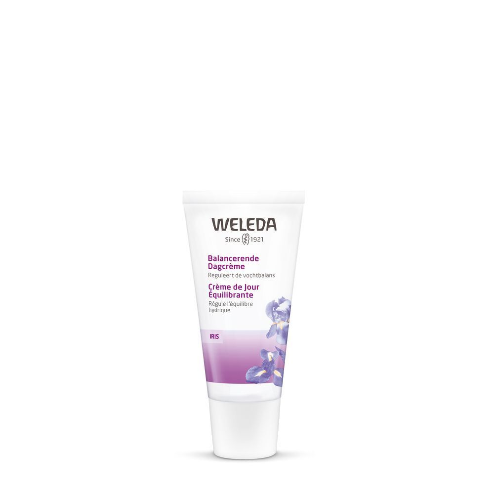Tubo crema Weleda Iris. Scritta in più lingue. Colori bianco e viola. Fiori di iris.