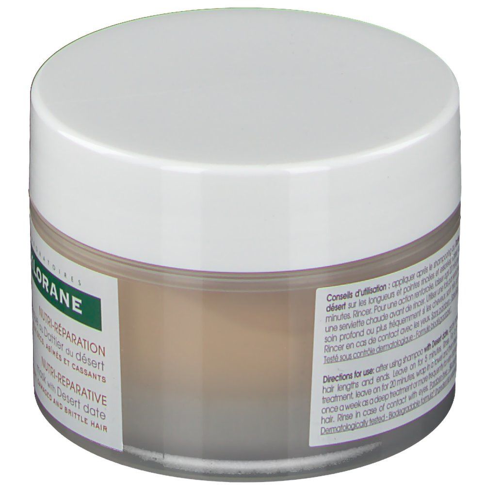 Barattolo di crema con coperchio bianco. Scritta: KLORANE. Testo: Istruzioni per l'uso. Dermatologicamente testato.