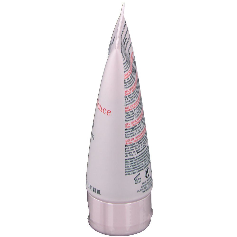Vista laterale del tubo. Tubo rosa con testo. Gelée exfoliante douce. Gel esfoliante delicato con petali di rosa. Per pelli sensibili.