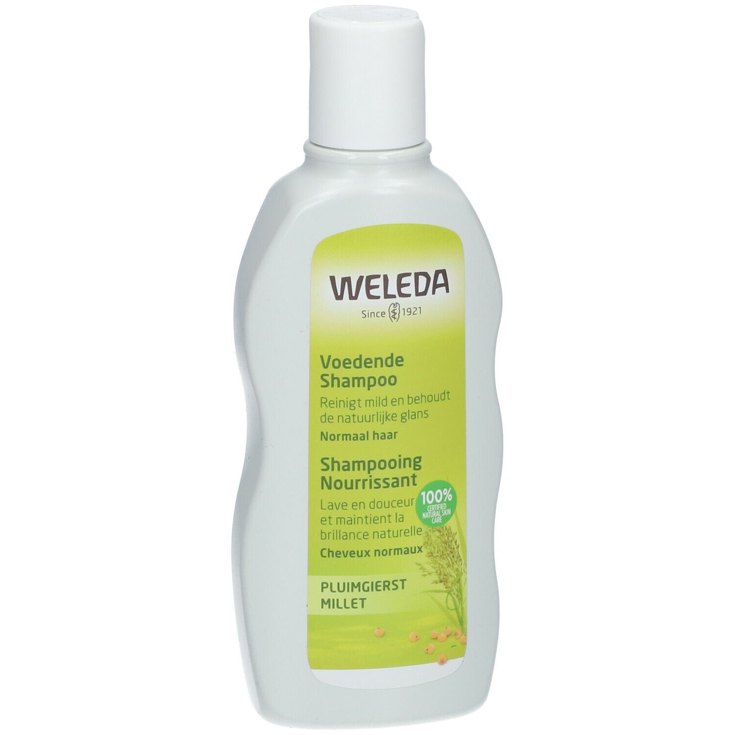 Flacone di shampoo Weleda. Etichetta verde e bianca con informazioni. Tappo bianco.