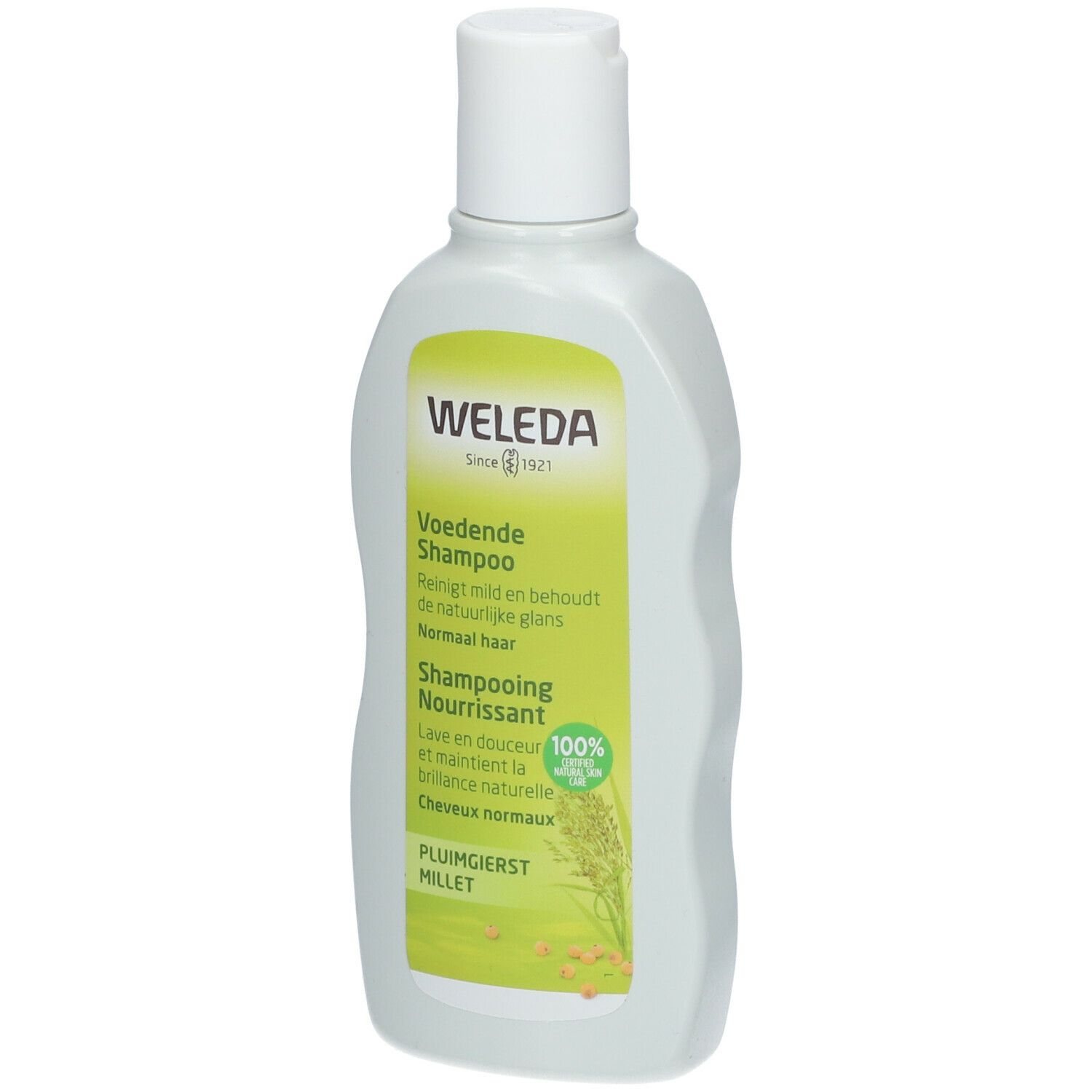 Flacone di shampoo Weleda. Etichetta verde e bianca con informazioni. Tappo bianco.