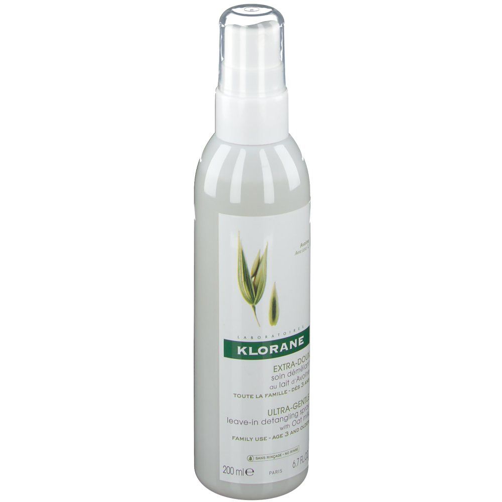 Flacone spray bianco con etichetta verde. Scritta: KLORANE, EXTRA-DOUX, spray districante senza risciacquo al latte d'avena.