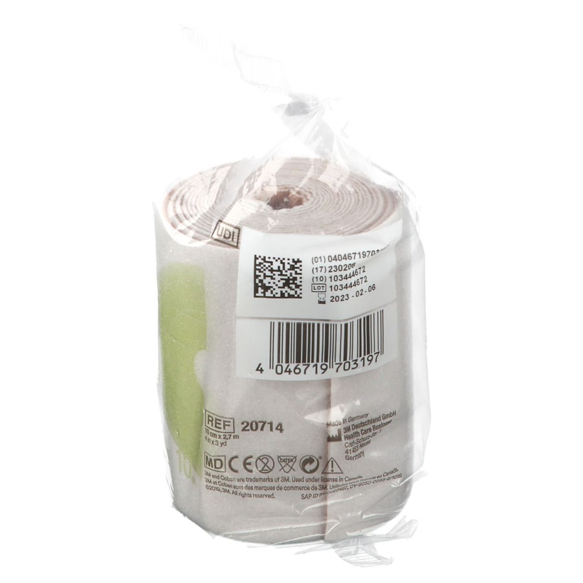 Rotolo di benda in confezione di plastica. Etichetta con informazioni. Strisce verdi. Confezione trasparente.