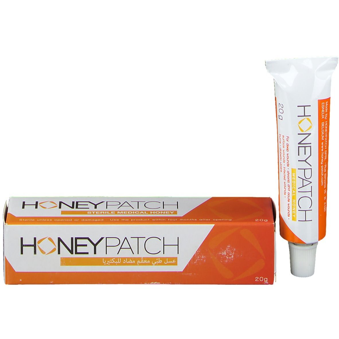 Confezione con tubo di miele. Design bianco-arancione. Scritta: Honeypatch. 20g. Miele medico sterile. Scrittura araba.