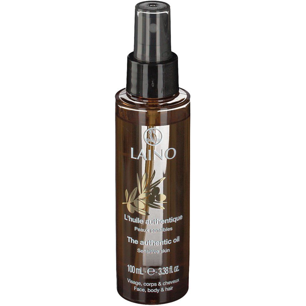 Flacone spray marrone con erogatore nero. Scritta: LAINO, L'huile authentique, The authentic oil, Pelle sensibile.