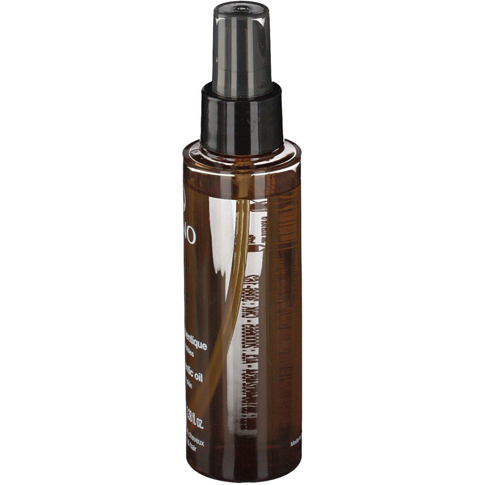 Flacone spray marrone con erogatore nero. Etichetta con informazioni sul prodotto. Liquido trasparente visibile.