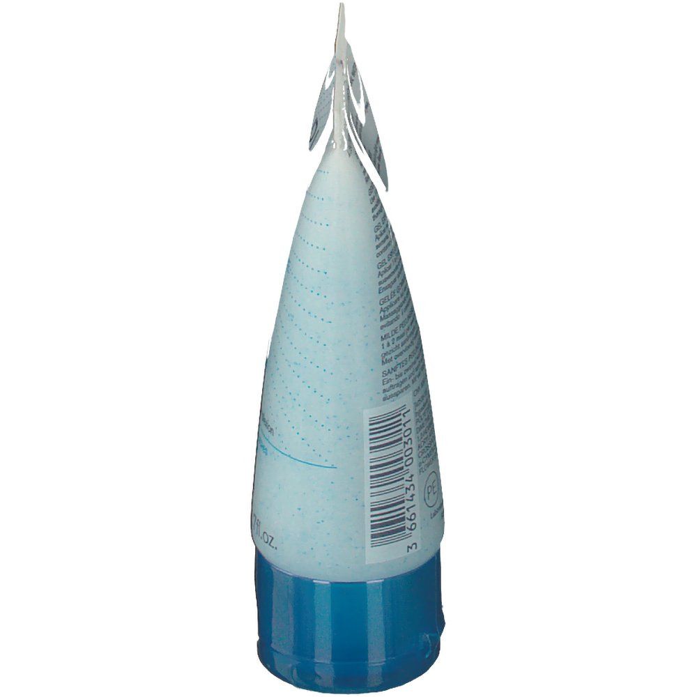 Il tubo è visto di lato. Il tappo è bianco, il resto azzurro chiaro. Scritta illeggibile.