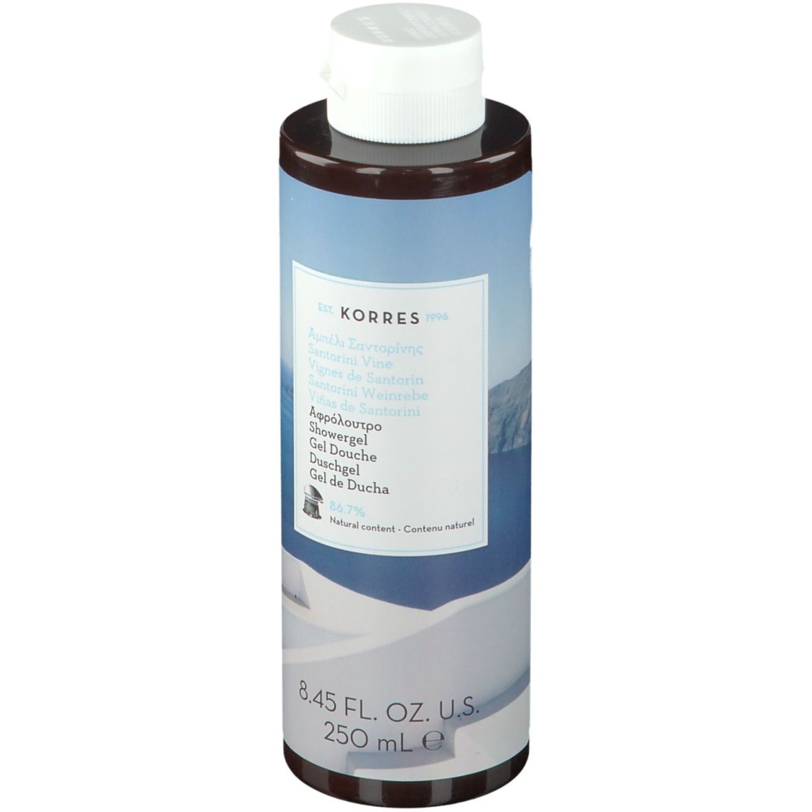 Gel doccia KORRES Santorini. Flacone cilindrico con tappo bianco. Etichetta con nome e informazioni.