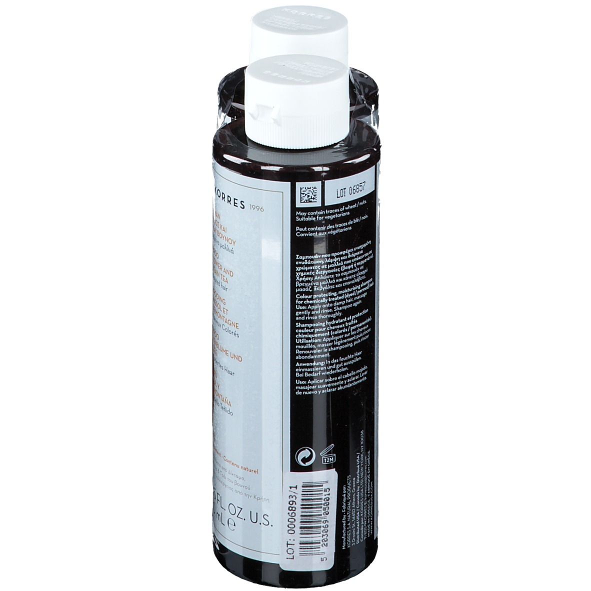 Due flaconi di shampoo. Flaconi neri, tappi bianchi. Testo: KORRES, Shampoo Girasole & Tè di Montagna. Ingredienti sul retro.