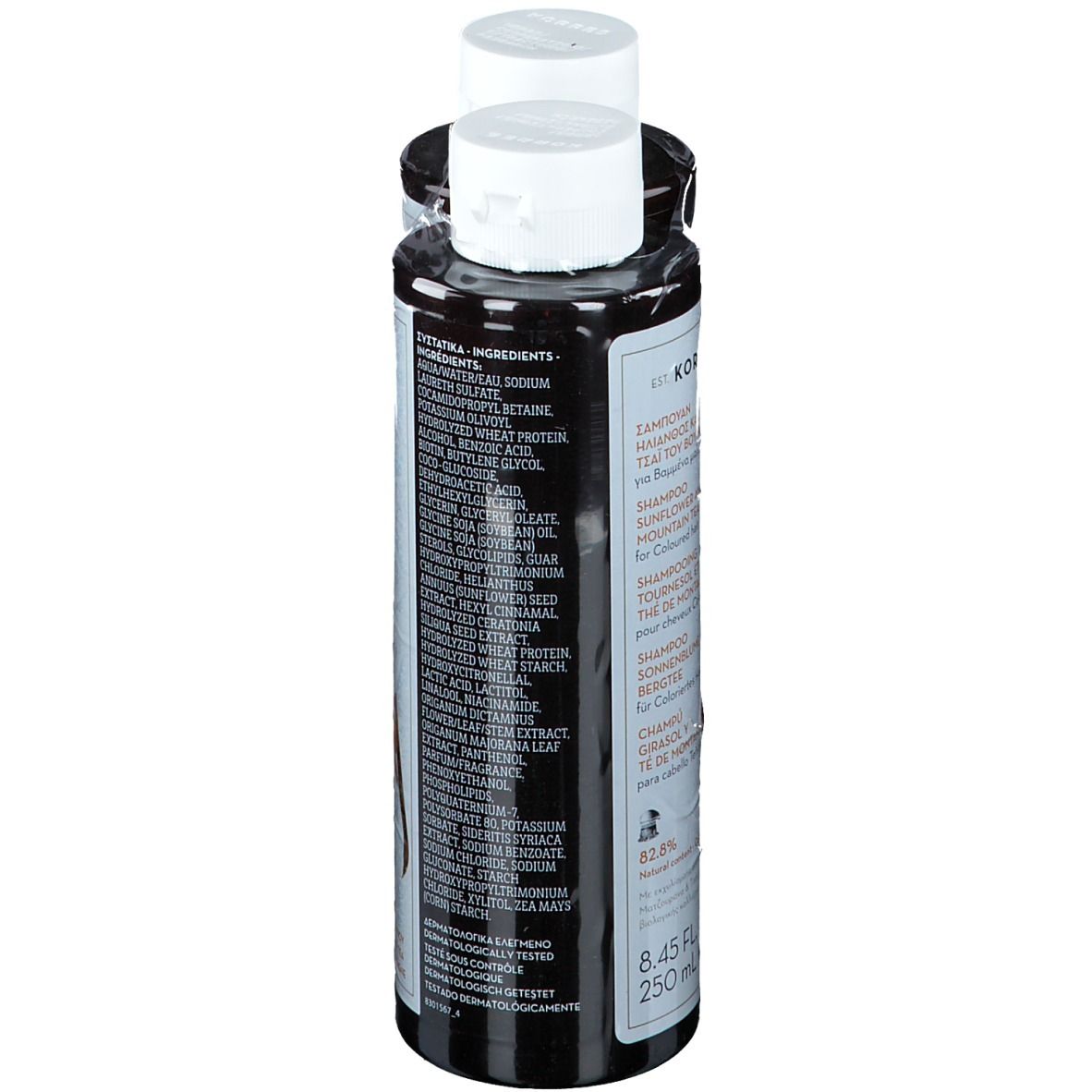 Due flaconi di shampoo. Flaconi neri, tappi bianchi. Testo: KORRES, Shampoo Girasole & Tè di Montagna. Ingredienti sul retro.