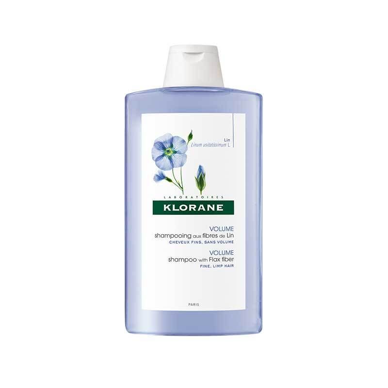 Shampoo Klorane con fibre di lino. Flacone blu con tappo bianco. Etichetta con motivo floreale e nome del prodotto.