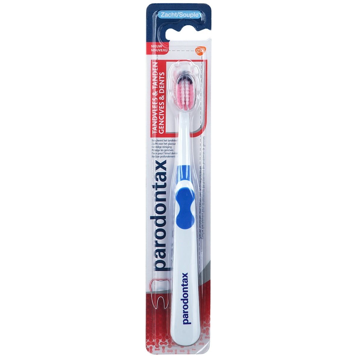 Spazzolino in confezione. Manico bianco con inserto blu, testina rossa. Marchio: Paradontax. Testo: Tandvlees & tanden, Zacht/Souple.