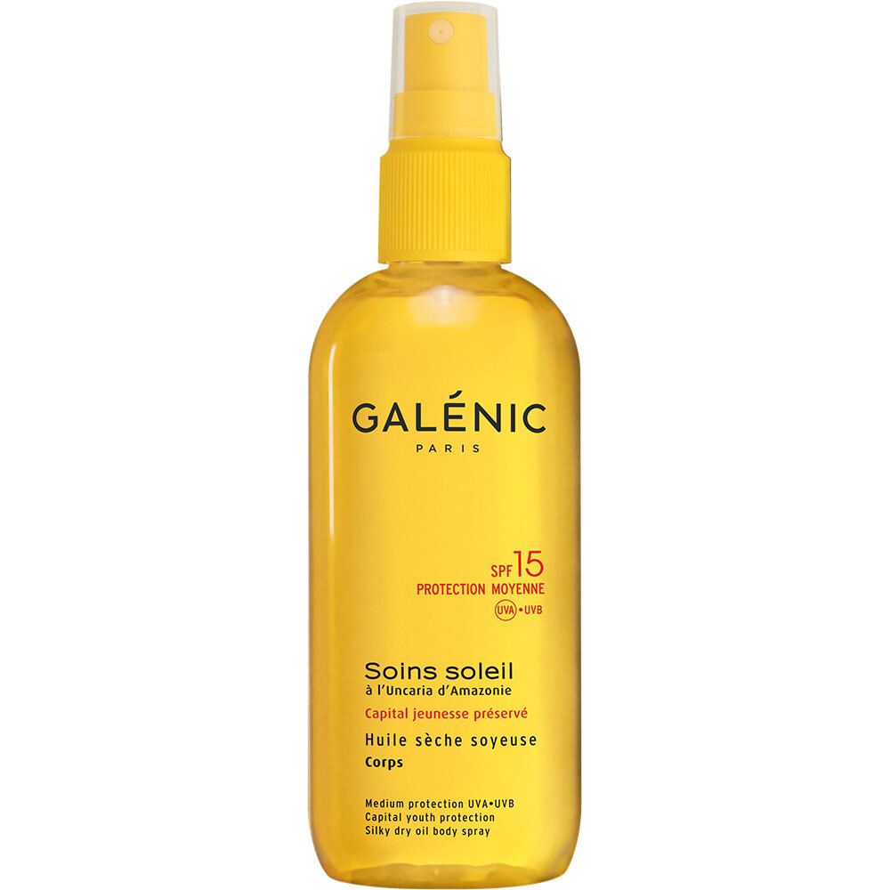 Flacone spray giallo con logo "GALÉNIC PARIS" e SPF 15. Testo: "Soins soleil", "Huile sèche soyeuse".