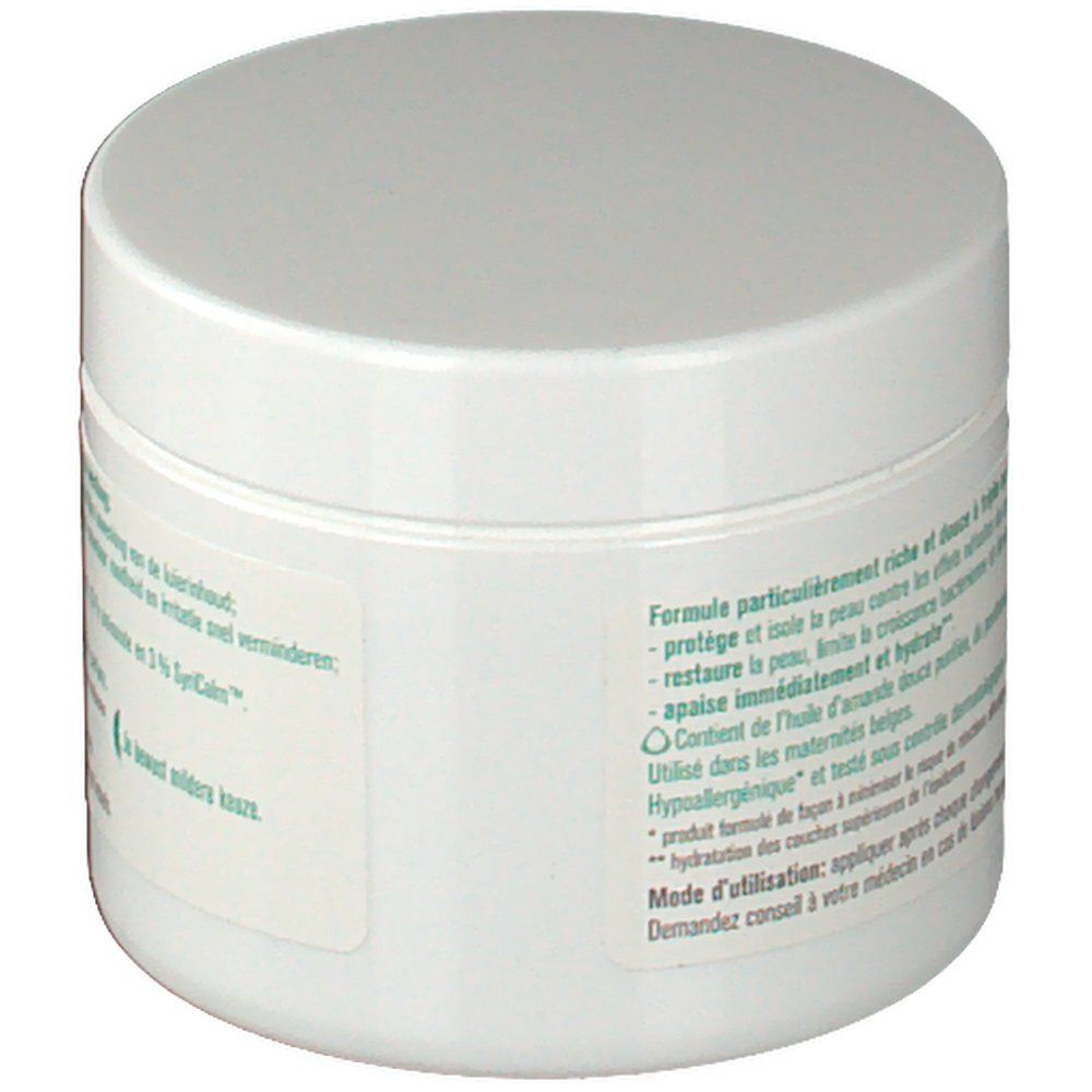 Vaso rotondo bianco con coperchio. Testo sull'etichetta riguardante gli ingredienti e gli effetti del prodotto.