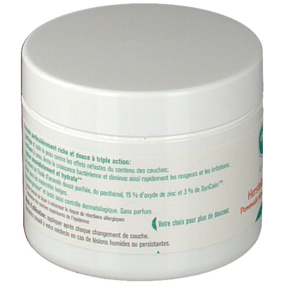 Vaso rotondo bianco con coperchio. Testo sull'etichetta riguardante gli ingredienti e gli effetti del prodotto.