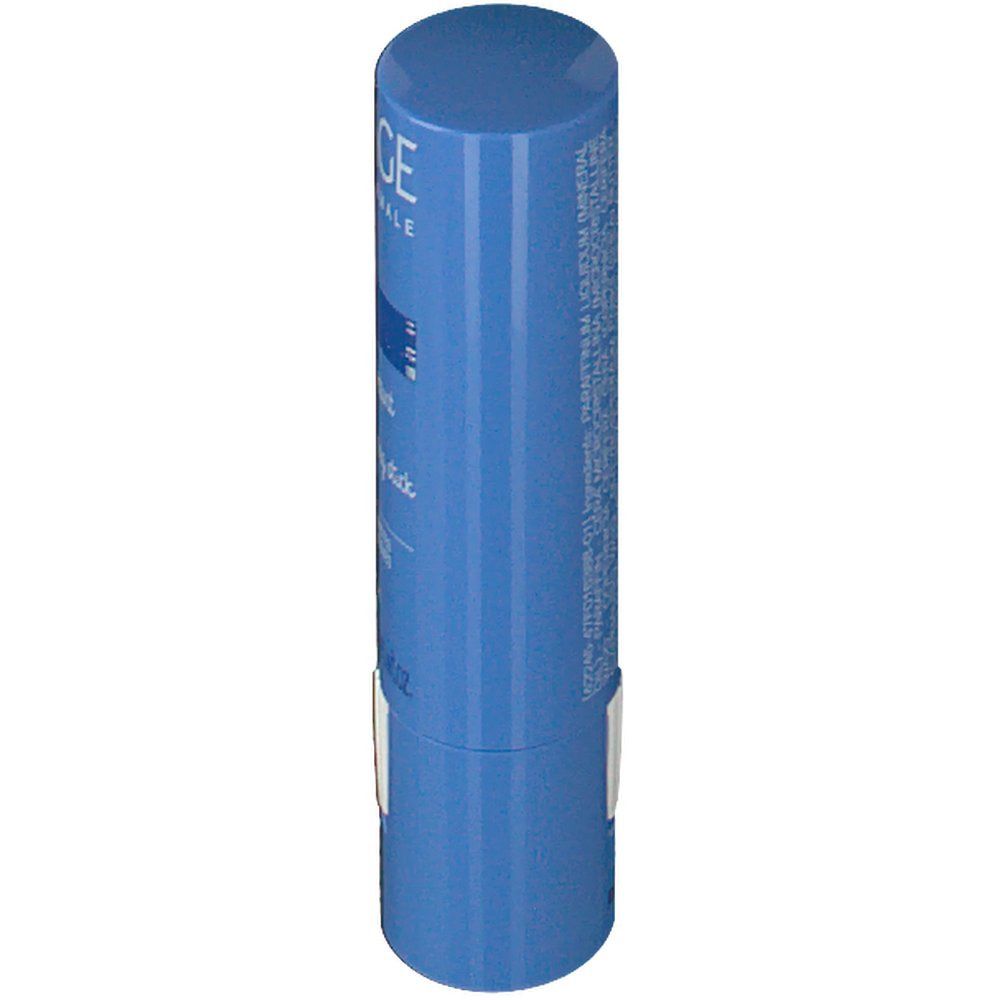 Stick blu, vista laterale. Adesivo bianco con testo. Logo Uriage e nome del prodotto parzialmente visibili.